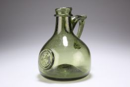 A GREEN GLASS SEAL FLAGON, mallet-shaped with short neck. 17cm high Provenance: The Chris Crabtree