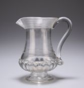 AN ENGLISH GLASS COIN JUG, EARLY 19TH CENTURY, moulded rings to the flared neck rim. 11.4cm high