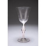 A LARGE ALE GLASS, CIRCA 1775, the bell-shaped bowl slightly slanted wrythens to the lower