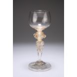 A VENETIAN GLASS GOBLET, CIRCA 1880, the cup-shaped bowl on a double ringed neck above four plain