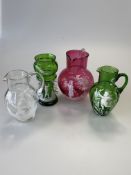 Four pieces of Victorian Mary Gregory glass inc. cranberry jug, green vase, etc. (4)