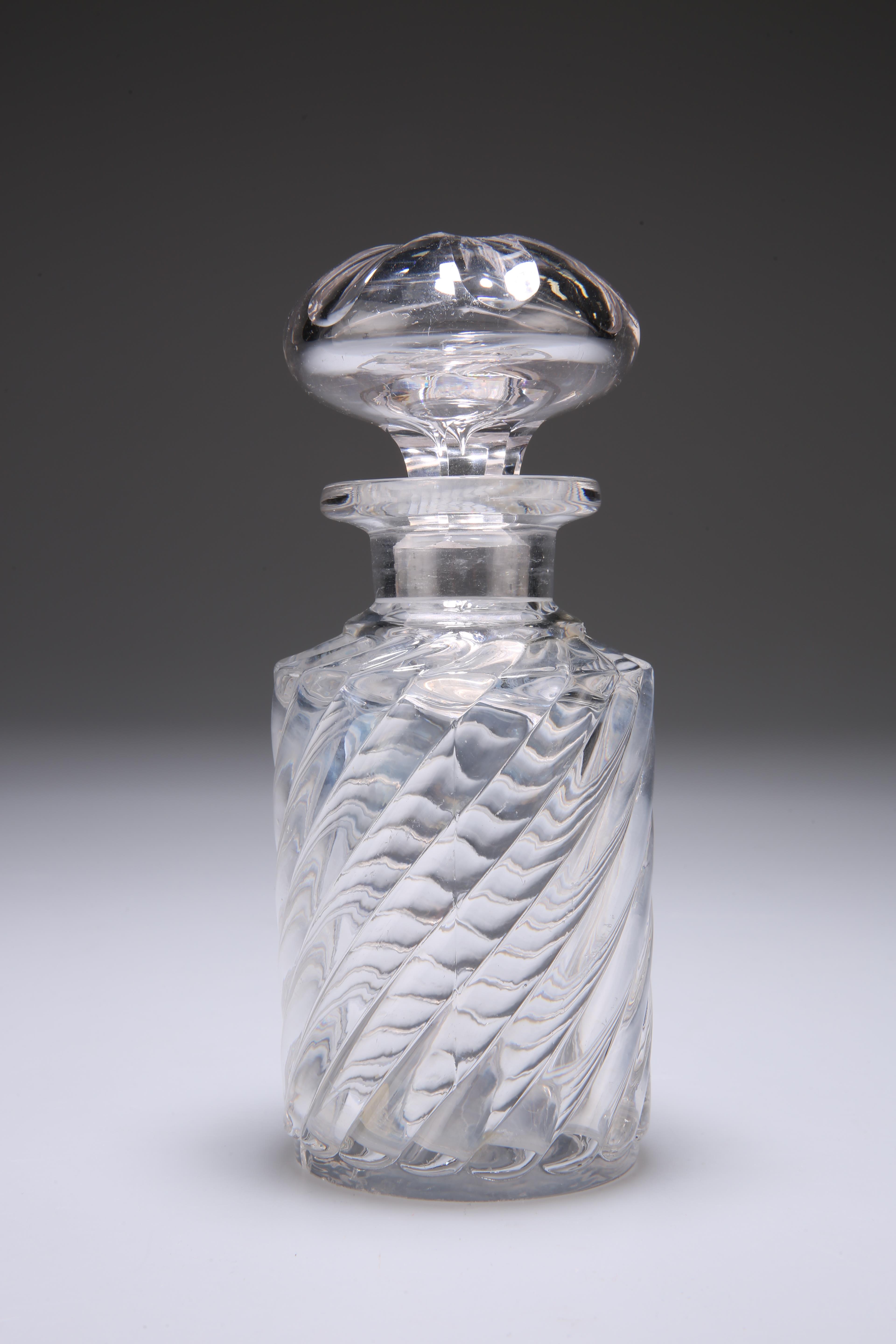 A LARGE CONTINENTAL GLASS SCENT BOTTLE AND STOPPER, the body decorated with swirl design. 16cm