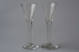 A PAIR OF LATE 18TH CENTURY WINE OR SCHNAPPS GLASSES, each funnel bowl engraved with monogram and