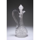 A LATE 19TH CENTURY CUT-GLASS CLARET JUG, the bulbous base issuing a faceted slender neck housing