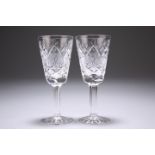A PAIR OF WATERFORD SHERRY OR PORT GLASSES, with extensive cutting to the bodies, signed. 13cm