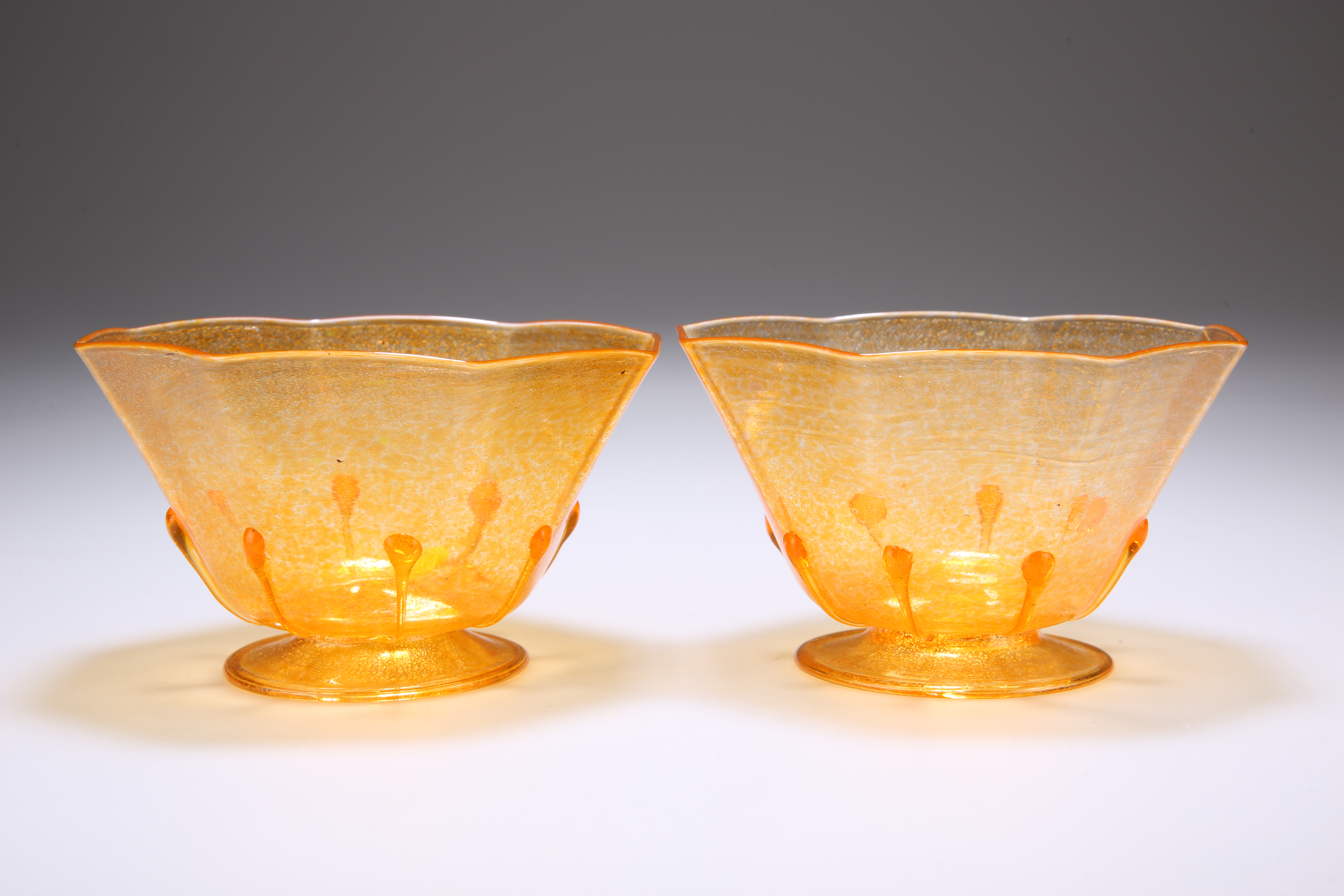 A PAIR OF MURANO GLASS BOWLS, the octagonal orange bodies with teadrops, raised on a folded foot