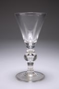 A LARGE VICTORIAN GLASS RUMMER IN THE FORM OF A GEORGIAN HEAVY BALUSTER GLASS