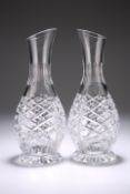 A PAIR OF CUT-GLASS CARAFES, with extensive cutting and panel cutting to the neck, star cutting to