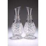 A PAIR OF CUT-GLASS CARAFES, with extensive cutting and panel cutting to the neck, star cutting to