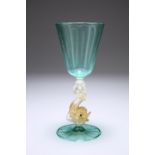A VENETIAN SALVIATI WINE GLASS, the turquoise bowl raised on a dolphin-form stem with gold flecking,