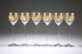 A SET OF SIX VENETIAN GILDED GLASS WINES, POSSIBLY SALVIATI, cut and gilded with roses, fronds and a
