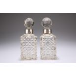 A PAIR OF EDWARDIAN GLASS SCENT BOTTLES WITH SILVER COLLARS by Miller Brothers, London 1903, of