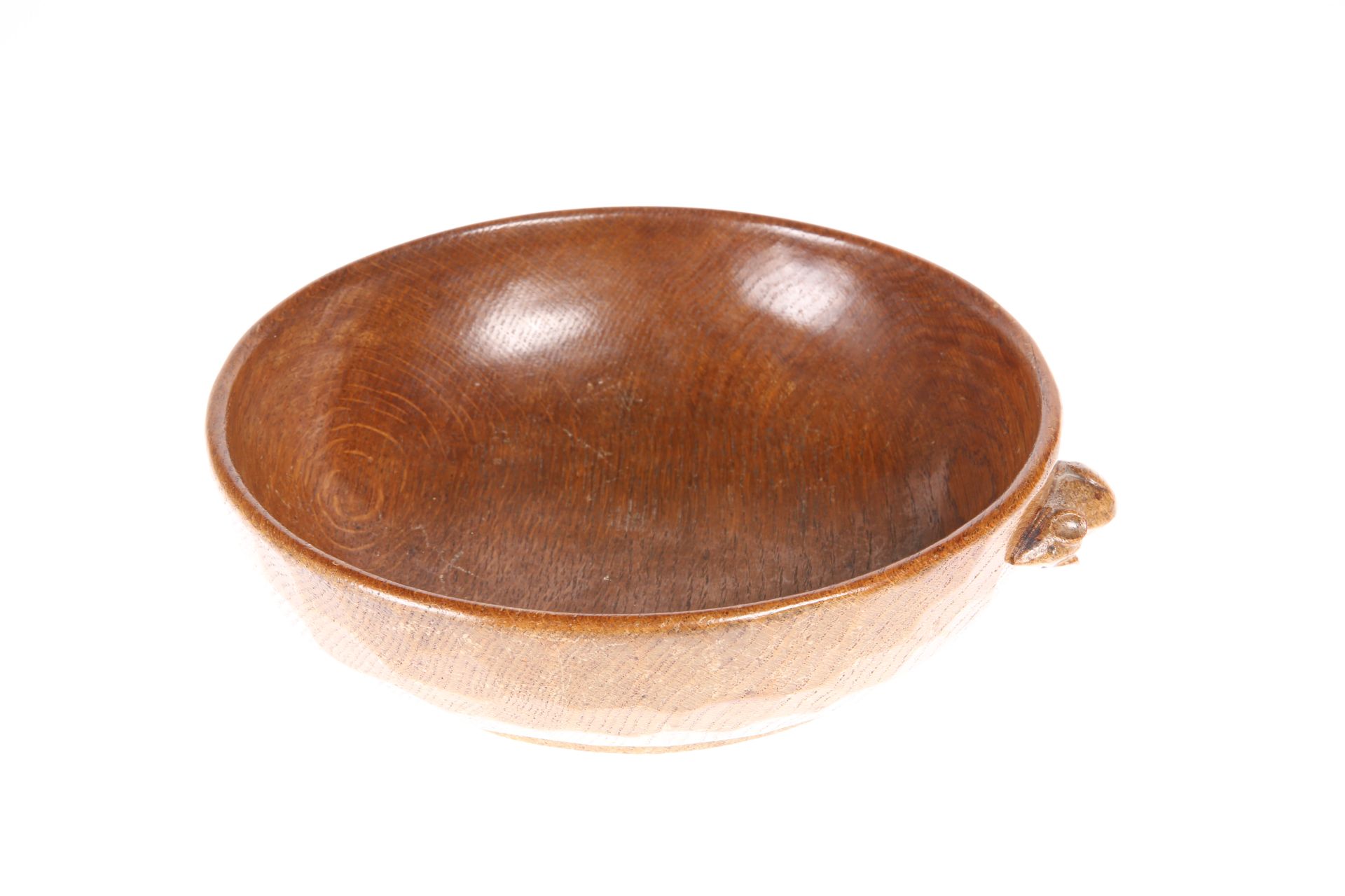 ROBERT THOMPSON OF KILBURN A MOUSEMAN OAK FRUIT BOWL, circular, the exterior adzed, carved mouse