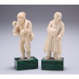 A PAIR OF 19TH CENTURY IVORY FIGURES, PROBABLY RUSSIAN, carved as peasants, on malachite bases. 11.