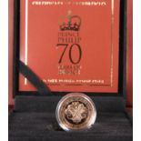 A GOLD ONE POUND PROOF COIN, "PRINCE PHILIP 70 YEARS OF SERVICE", boxed with certificate numbered