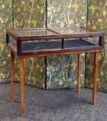 A VICTORIAN AND LATER MAHOGANY VITRINE TABLE, the rectangular case with hinged fall-front, raised on