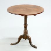 A GEORGE III MAHOGANY TRIPOD TABLE, the circular top raised on a turned stem continuing to hipped