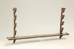 AN 18TH CENTURY OAK SPIT (OR FISHING ROD) RACK, with three pairs of brackets and shelf base. 163cm