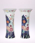 A PAIR OF CHINESE 'TOBACCO LEAF' VASES, of flared cylindrical form, painted in the famille rose