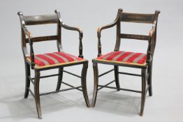 A PAIR OF REGENCY PAINTED OPEN ARMCHAIRS, each with foliate painted bar-back and splat with
