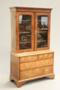 AN EARLY 18TH CENTURY FEATHERBANDED WALNUT CABINET ON CHEST