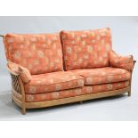 AN ERCOL "RENAISSANCE" GOLDEN DAWN THREE PIECE LOUNGE SUITE, comprising a three-seater sofa and a