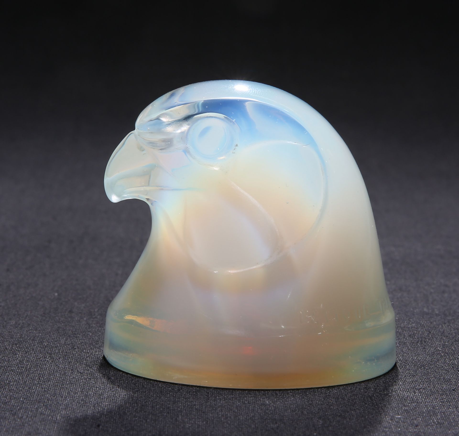 RENÉ LALIQUE (FRENCH, 1860-1945) A 'TETE D'EPERVIER' CAR MASCOT, DESIGNED IN 1928, opalescent glass,