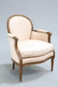 A LOUIS XV STYLE BEECH BERGERE, raised on fluted tapering legs