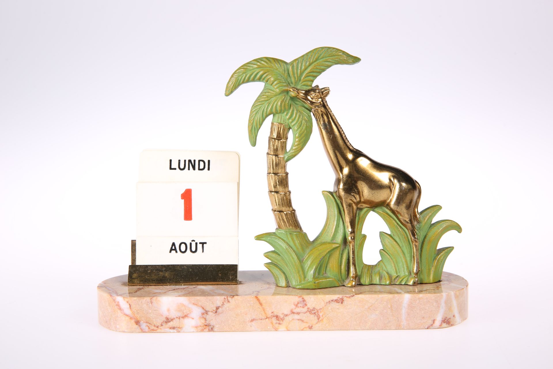 A FRENCH ART DECO 'GIRAFFE' CALENDAR, the marble base with rounded ends, supporting the spelter