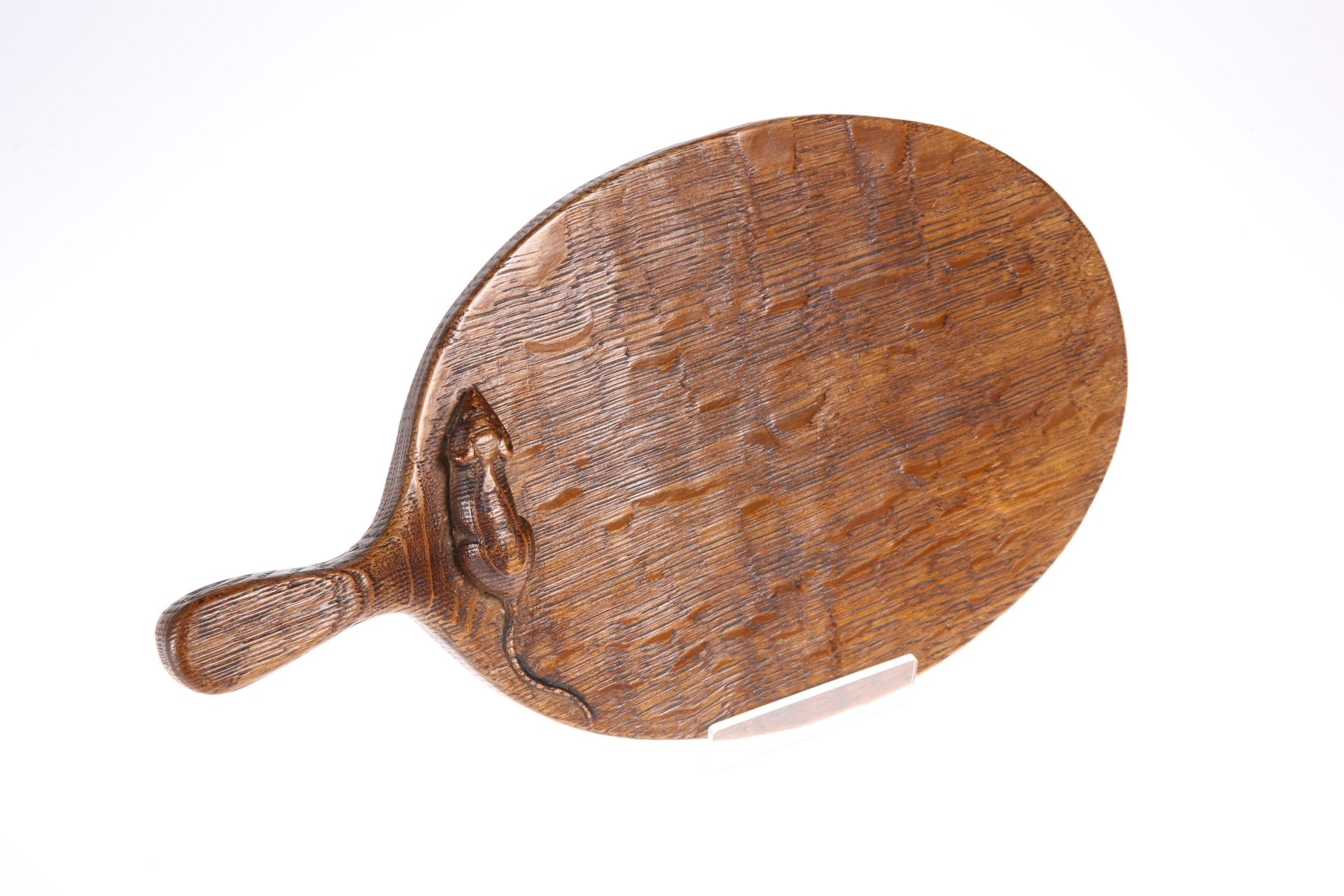 ROBERT THOMPSON OF KILBURN AN EARLY MOUSEMAN OAK CHEESEBOARD, carved mouse signature to the oval