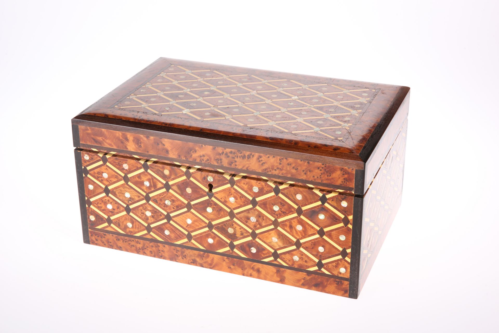 A MOTHER-OF-PEARL INLAID BURR YEW CASKET, of good quality, rectangular with hinged lid and lift-