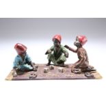 AFTER FRANZ BERGMAN, A COLD-PAINTED BRONZE GROUP, depicting three Arab boys playing dice on a