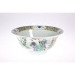 A CHINESE FAMILLE VERTE BOWL, circular with everted rim, the exterior painted with figures in the