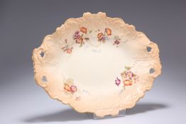 A ROYAL WORCESTER BLUSH IVORY BOWL, of shaped oval form with twin pierced handles, painted with four