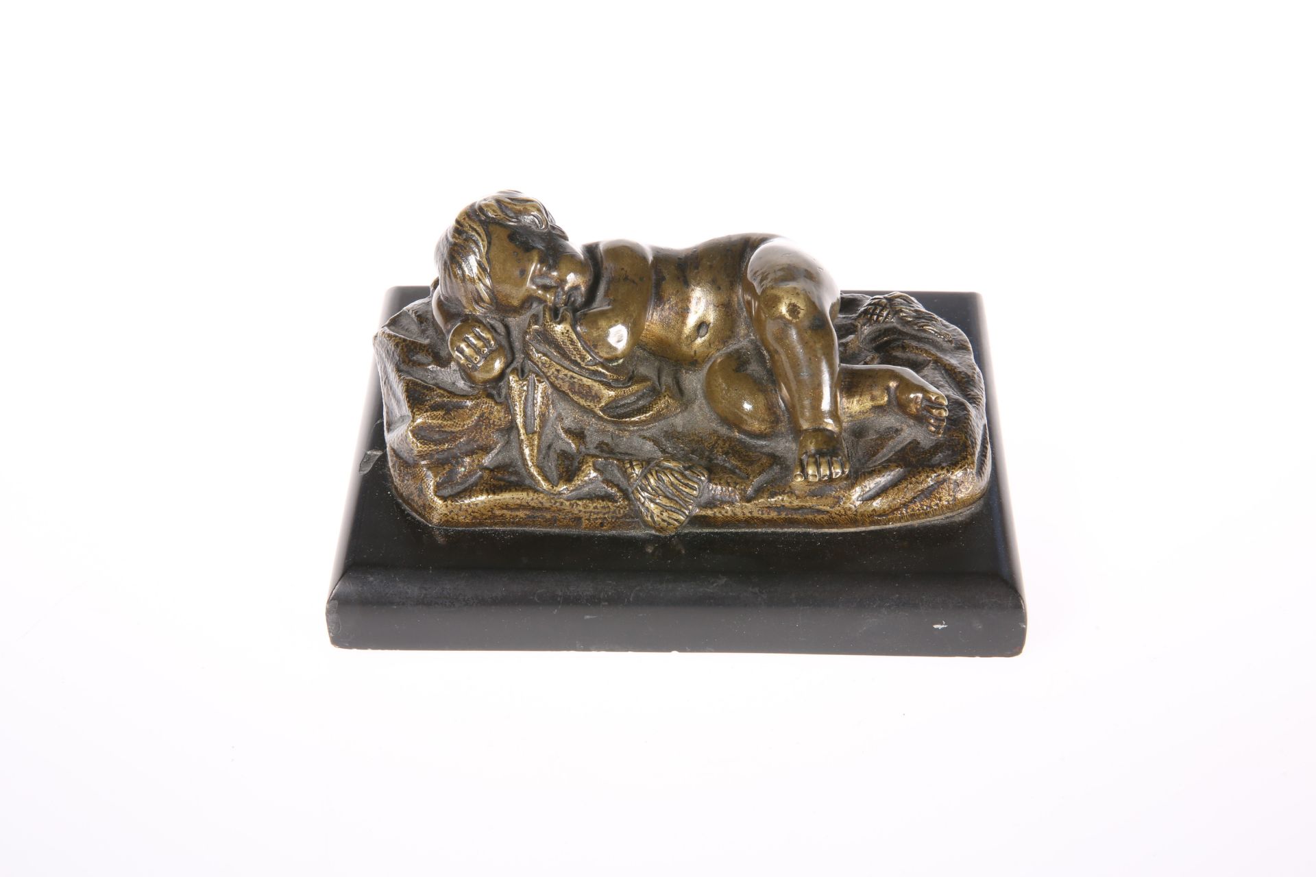 A 19TH CENTURY FRENCH BRONZE FIGURE OF A SLEEPING PUTTO