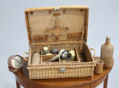 ~ A DREW & SONS OF PICCADILLY VINTAGE WICKER BASKET, containing bottles, cutlery etc.