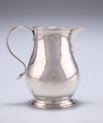 A GEORGIAN SILVER CREAM JUG, possibly by James Stone, maker's mark only, of small baluster form,