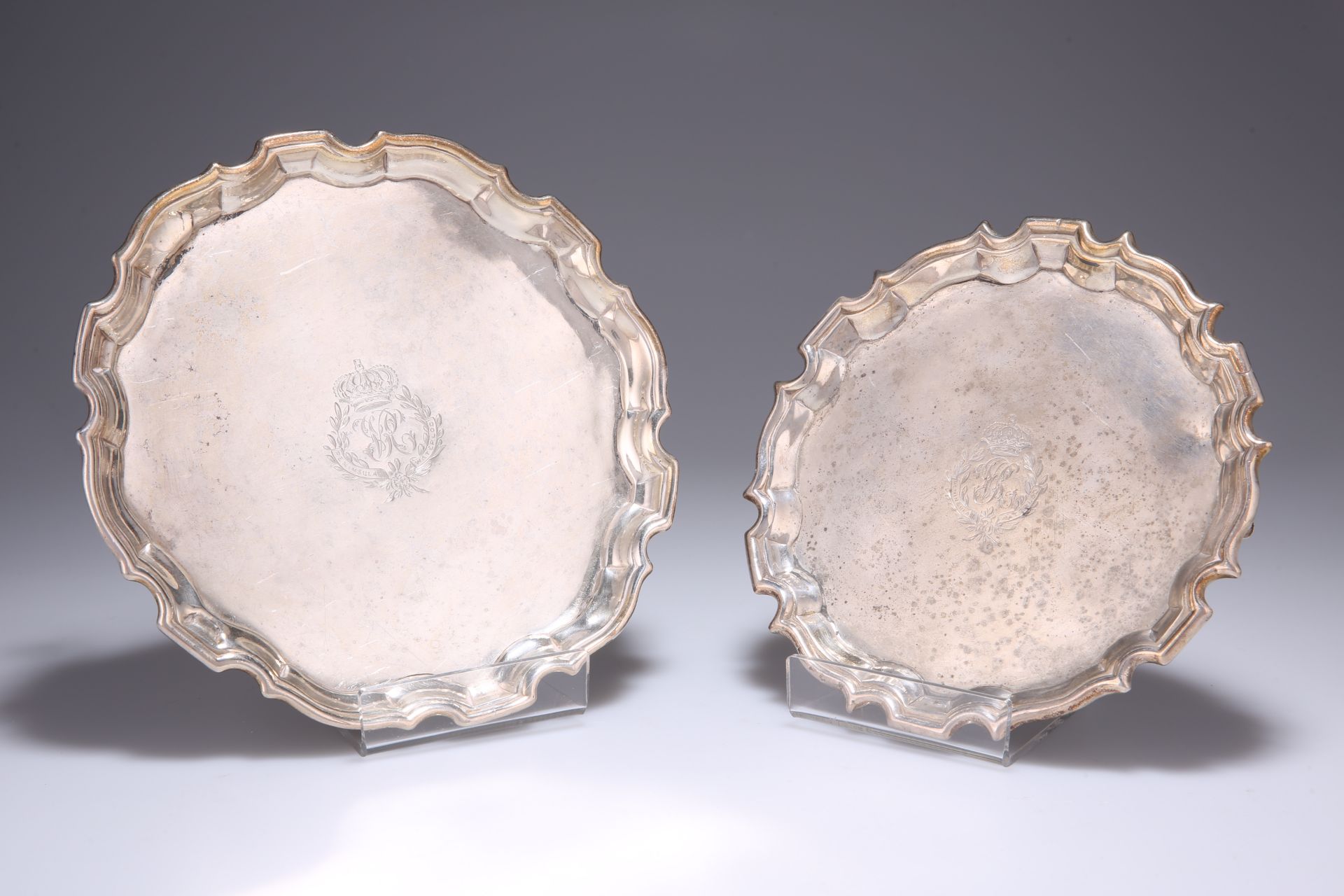 ^ A GEORGE II SILVER WAITER, by Dorothy Mills, London 1753, shaped circular form, engraved crest