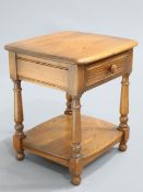 AN ERCOL GOLDEN DAWN SIDE TABLE fitted with a drawer. 47.5cm wide