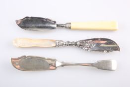 A GROUP OF THREE VICTORIAN SILVER BUTTER KNIVES: the first by Robert Stebbings, London 1894,