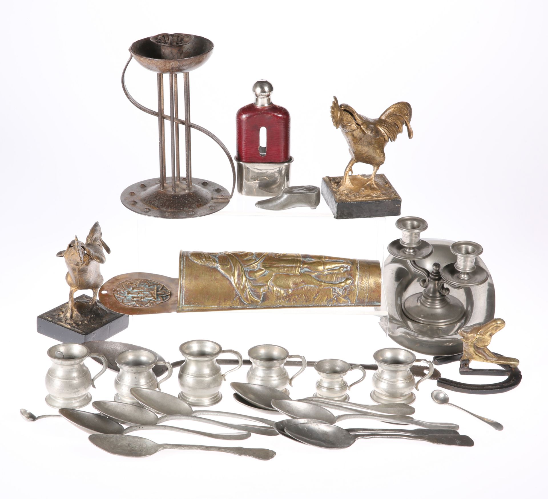 A GROUP OF METALWORK, including wrought iron chamberstick; pewter measures; pewter spoons; brass