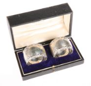 A MATCHED PAIR OF SILVER NAPKIN RINGS, the first by George Maudsley Jackson & David Landsborough