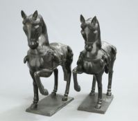 A LARGE PAIR OF BRONZE HORSES, each cast saddled and with a raised front leg. 92cm high