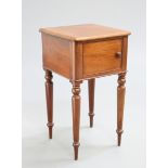 A VICTORIAN MAHOGANY POT CUPBOARD, the top with rounded corners above a cupboard door with turned