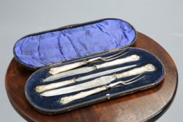 ~ AN EDWARDIAN SILVER-HANDLED FIVE-PIECE CARVING SET, by George Howson, Sheffield 1902, in a