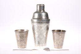 A PERSIAN SILVER COCKTAIL SHAKER, decorated throughout with dense foliage, marked; together with A
