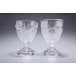 A PAIR OF 19TH CENTURY GLASS RUMMERS, each etched with polo players, raised on square lemon-squeezer