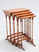 A QUARTET OF MAHOGANY SPIDER LEG NESTING TABLES, each rectangular top with oval panel. Largest 71.