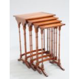 A QUARTET OF MAHOGANY SPIDER LEG NESTING TABLES, each rectangular top with oval panel. Largest 71.