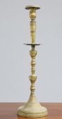 ~ A LARGE 18TH CENTURY BRASS CANDLESTICK, with domed base and knopped baluster stem. 68.5cm high